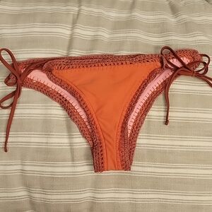 Orange and pink reversible bikini bottoms with crotchet trim size small